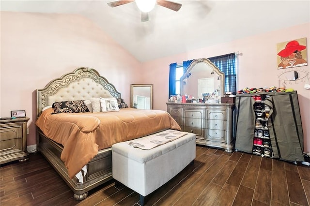 bedroom featuring lofted ceiling, a ceiling fan, and dark wood-style flooring