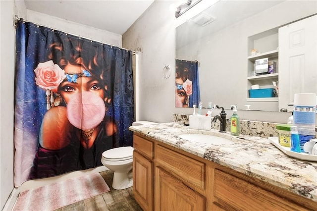 full bath with curtained shower, toilet, vanity, and wood finished floors