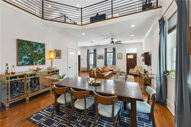 dining space with recessed lighting, crown molding, a ceiling fan, and wood finished floors