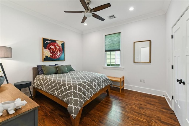 bedroom with recessed lighting, visible vents, wood finished floors, and ornamental molding