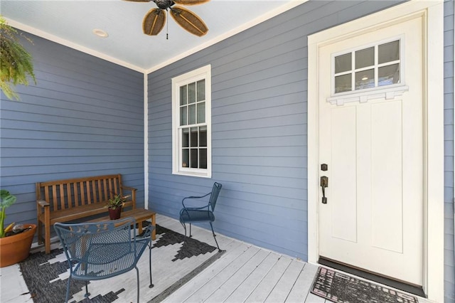 doorway to property with a ceiling fan