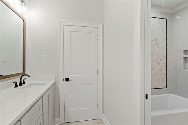 full bath with a bathing tub and vanity