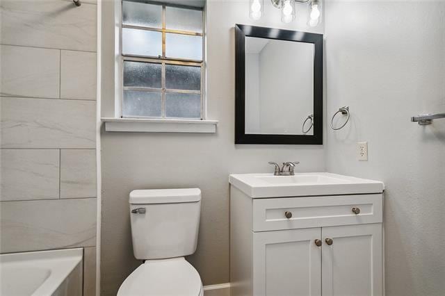 bathroom with vanity and toilet