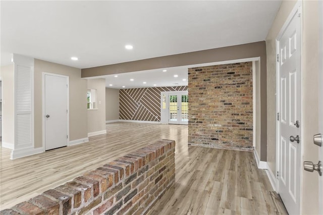 foyer with recessed lighting, light wood-style floors, and baseboards