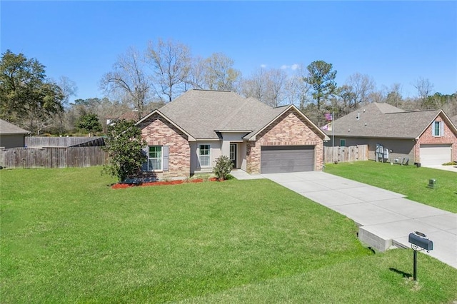 view of front facade with a front yard, fence, an attached garage, concrete driveway, and brick siding