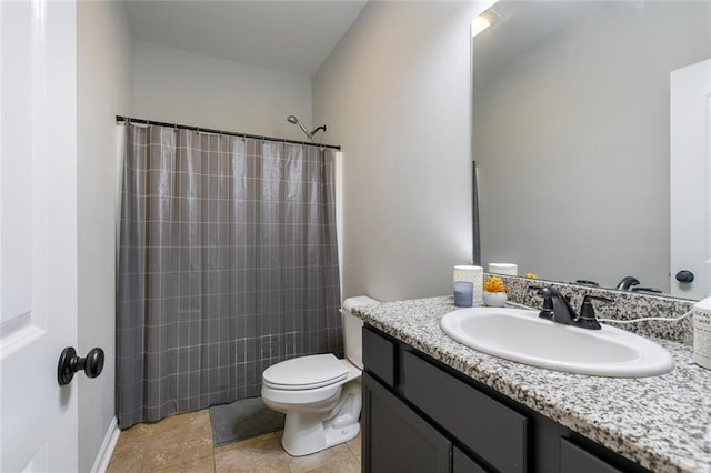 bathroom featuring vanity, a shower with shower curtain, and toilet