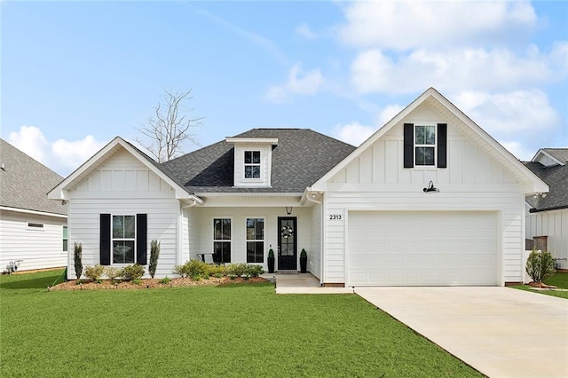 modern inspired farmhouse featuring board and batten siding, concrete driveway, a front lawn, and a shingled roof