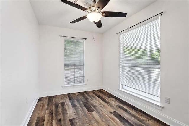 empty room featuring plenty of natural light, baseboards, and ceiling fan