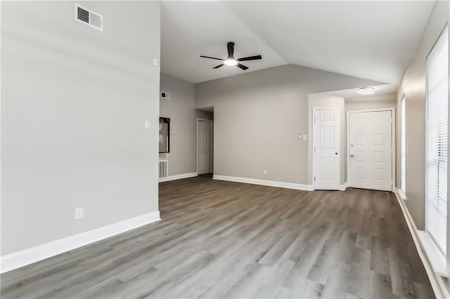 unfurnished living room featuring visible vents, wood finished floors, baseboards, and ceiling fan