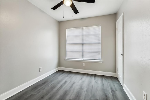 unfurnished bedroom featuring ceiling fan, baseboards, and dark wood-style flooring