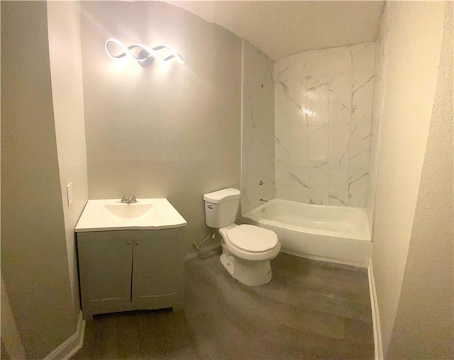 full bathroom featuring toilet, vanity, and baseboards