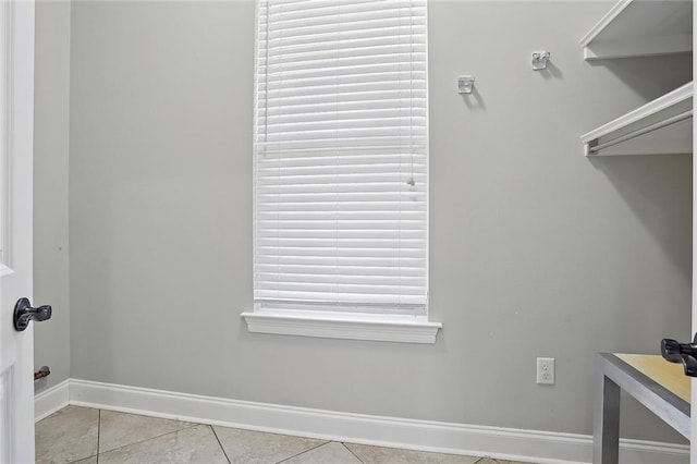 walk in closet featuring light tile patterned floors