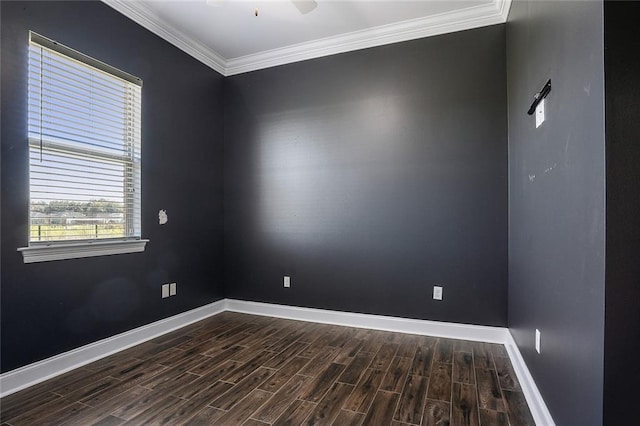 empty room with baseboards, a ceiling fan, dark wood-style flooring, and crown molding