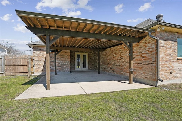 view of patio / terrace with french doors and fence