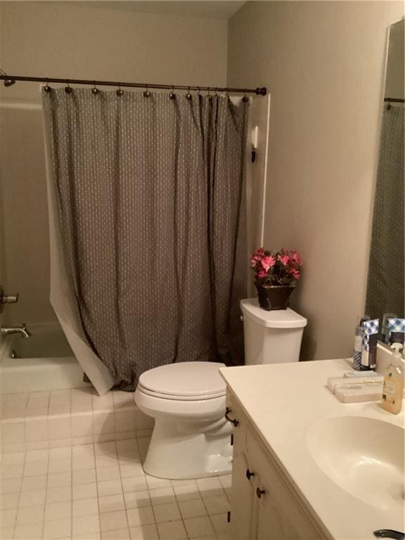 bathroom featuring vanity, toilet, and tile patterned flooring