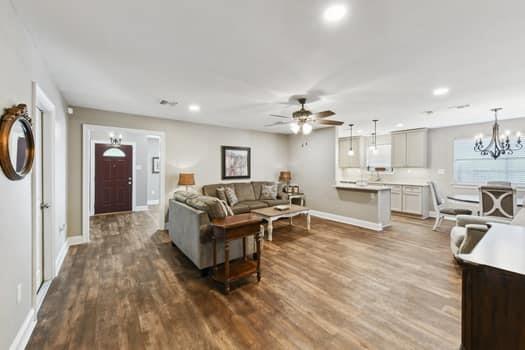 1913 Satsuma St, Metairie, LA 70001 - living room with ceiling fan, baseboards, dark wood-style floors, a chandelier, and recessed lighting