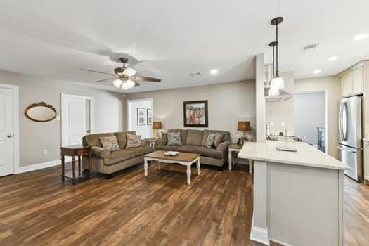 1913 Satsuma St, Metairie, LA 70001 - living area with dark wood finished floors, a ceiling fan, recessed lighting, and baseboards