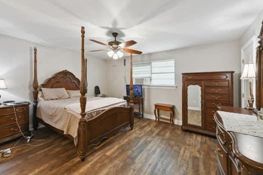 1913 Satsuma St, Metairie, LA 70001 - bedroom with dark wood-type flooring, baseboards, and a ceiling fan