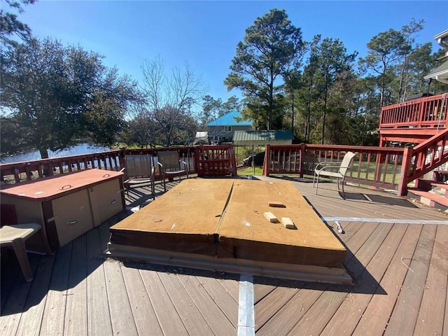 wooden deck with a water view