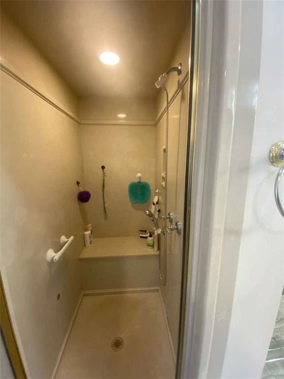 full bath with a shower stall