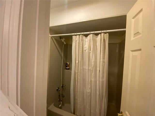 bathroom with shower / bath combination with curtain