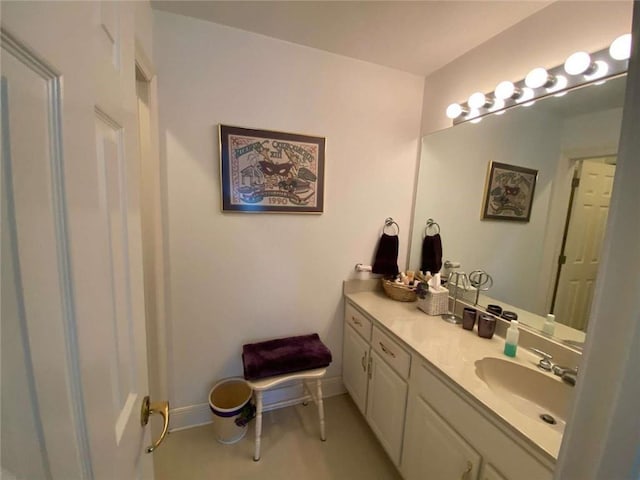 bathroom featuring vanity and baseboards