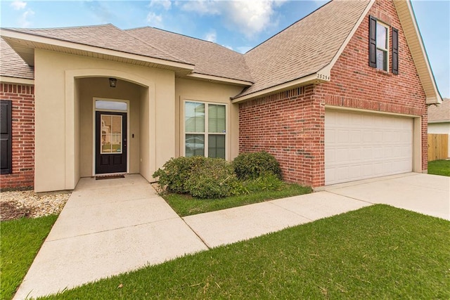 exterior space featuring concrete driveway, a garage, brick siding, and a shingled roof