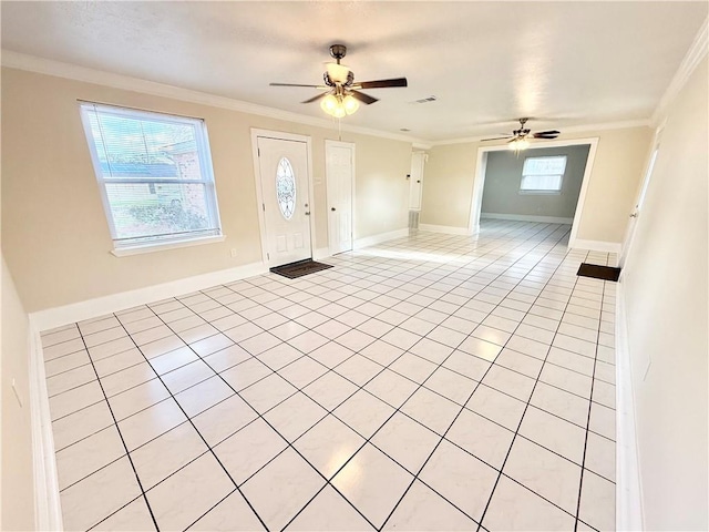 foyer featuring ornamental molding, light tile patterned flooring, baseboards, and ceiling fan