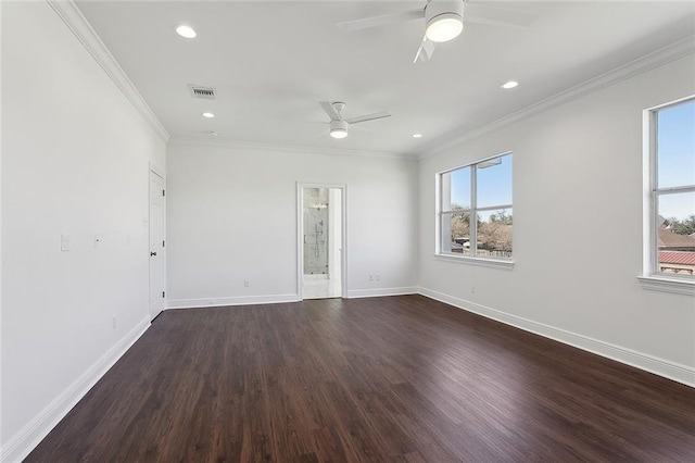 spare room featuring visible vents, baseboards, crown molding, and a ceiling fan