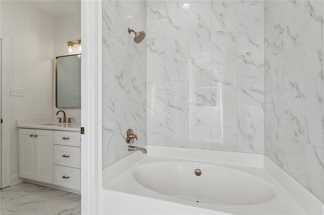 bathroom featuring vanity, bathing tub / shower combination, and marble finish floor