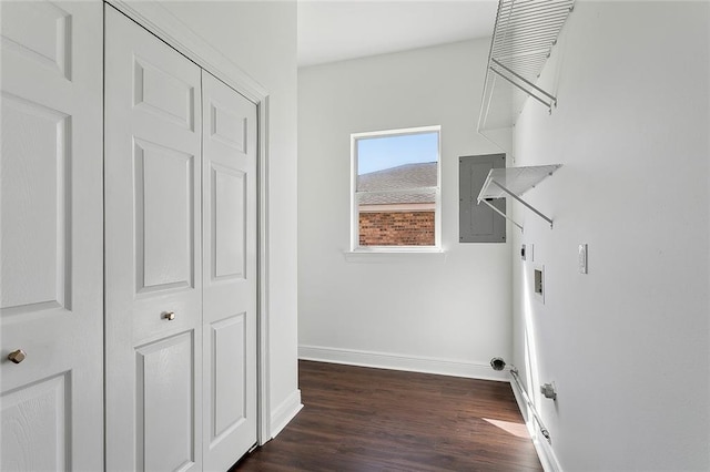 washroom featuring baseboards, washer hookup, electric panel, laundry area, and dark wood-style floors