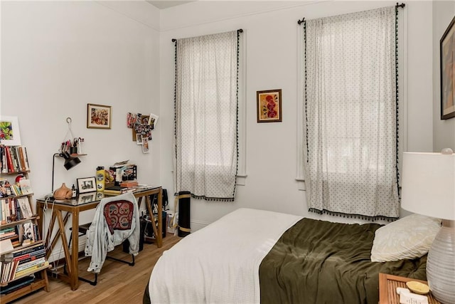 bedroom featuring wood finished floors