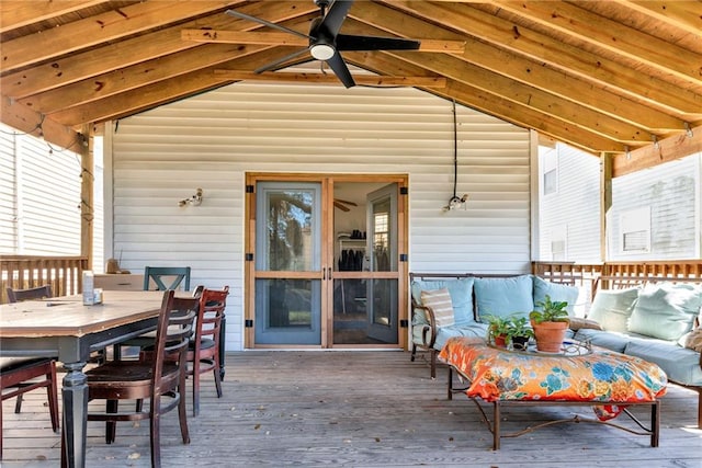 view of patio / terrace featuring a deck, an outdoor living space, outdoor dining space, and ceiling fan