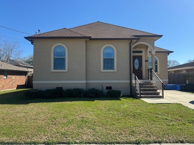 view of front of home with a front yard, fence, roof with shingles, and crawl space