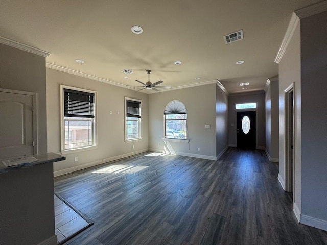 entryway featuring visible vents, plenty of natural light, dark wood-type flooring, and a ceiling fan