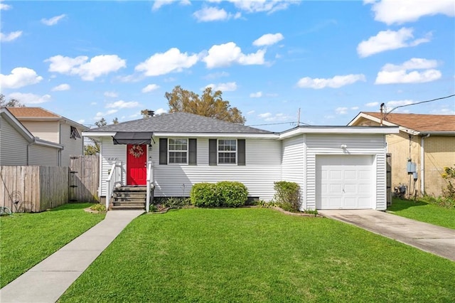 view of front of house with a front yard, fence, a garage, and driveway