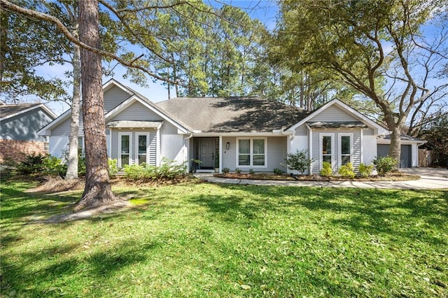 ranch-style home featuring a garage, concrete driveway, and a front lawn