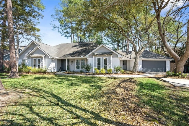 ranch-style house featuring a garage, concrete driveway, and a front lawn