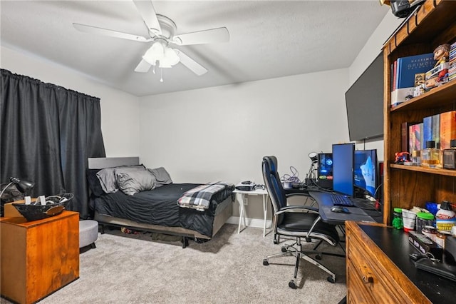 bedroom with baseboards, a ceiling fan, and carpet