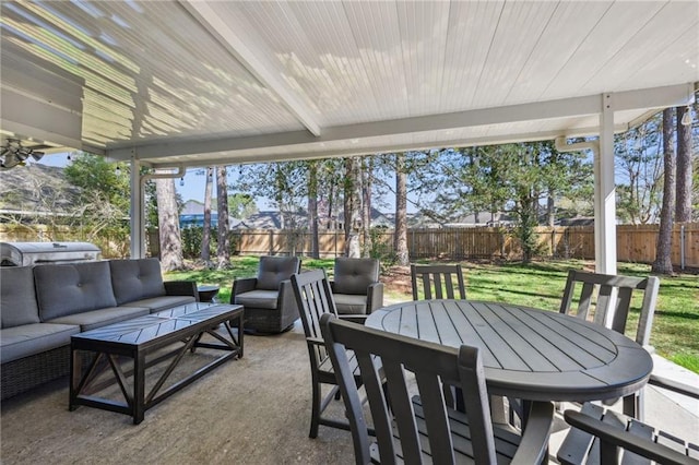 view of patio / terrace featuring an outdoor living space, outdoor dining area, and a fenced backyard