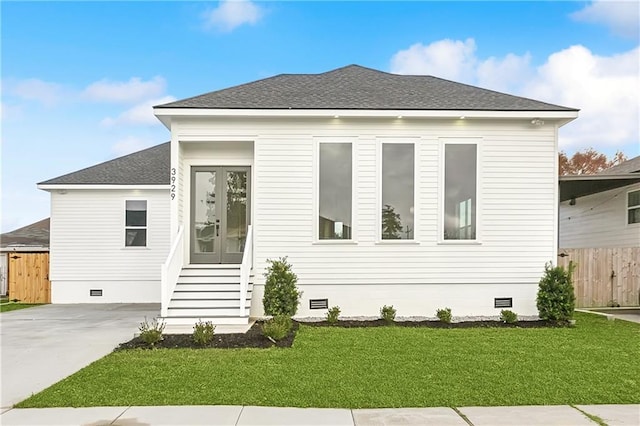 view of front of house with a front lawn, french doors, fence, and crawl space