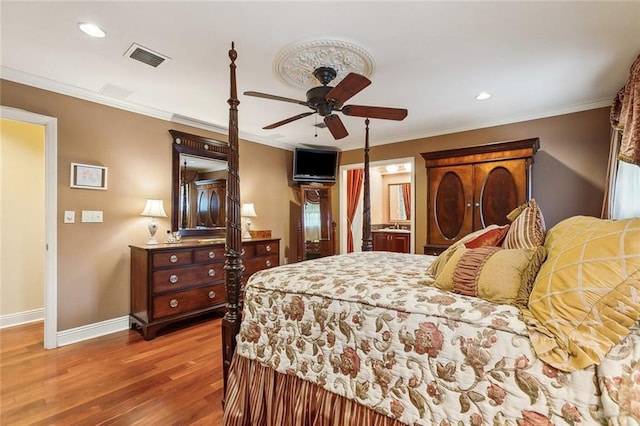 bedroom with visible vents, crown molding, baseboards, recessed lighting, and wood finished floors