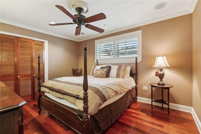 bedroom featuring crown molding, wood finished floors, and baseboards