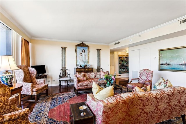 living room with visible vents, baseboards, wood finished floors, and ornamental molding