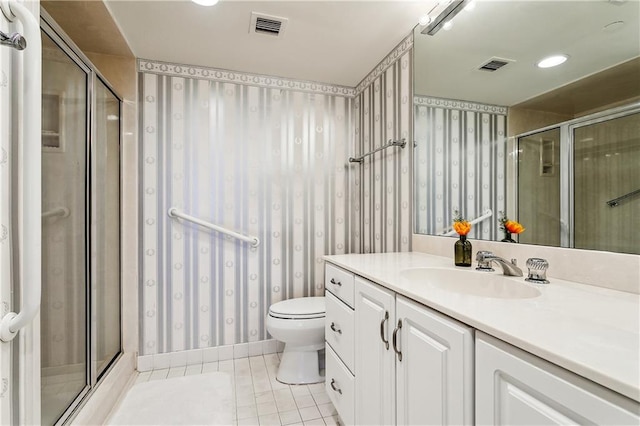 full bath featuring wallpapered walls, vanity, visible vents, and tile patterned flooring