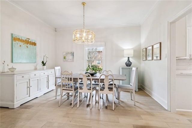 4533 N Turnbull Dr, Metairie, LA 70002 - dining room with baseboards, a chandelier, crown molding, and light wood finished floors