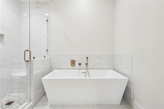4533 N Turnbull Dr, Metairie, LA 70002 - full bathroom featuring a freestanding tub, a marble finish shower, and marble finish floor