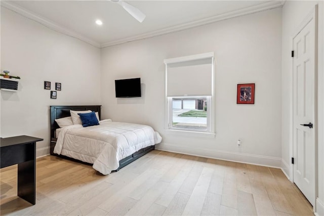 4533 N Turnbull Dr, Metairie, LA 70002 - bedroom with baseboards, light wood-style flooring, recessed lighting, ceiling fan, and crown molding