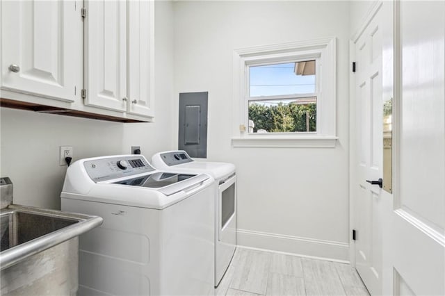 4533 N Turnbull Dr, Metairie, LA 70002 - washroom with washing machine and clothes dryer, baseboards, electric panel, cabinet space, and a sink