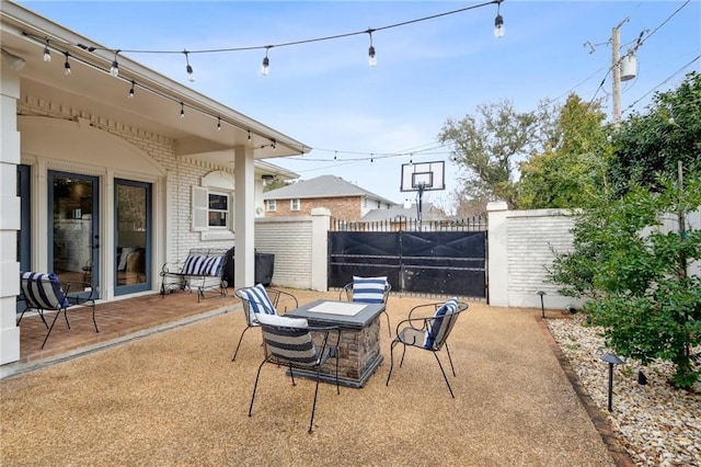 4533 N Turnbull Dr, Metairie, LA 70002 - view of patio / terrace featuring fence and a fire pit